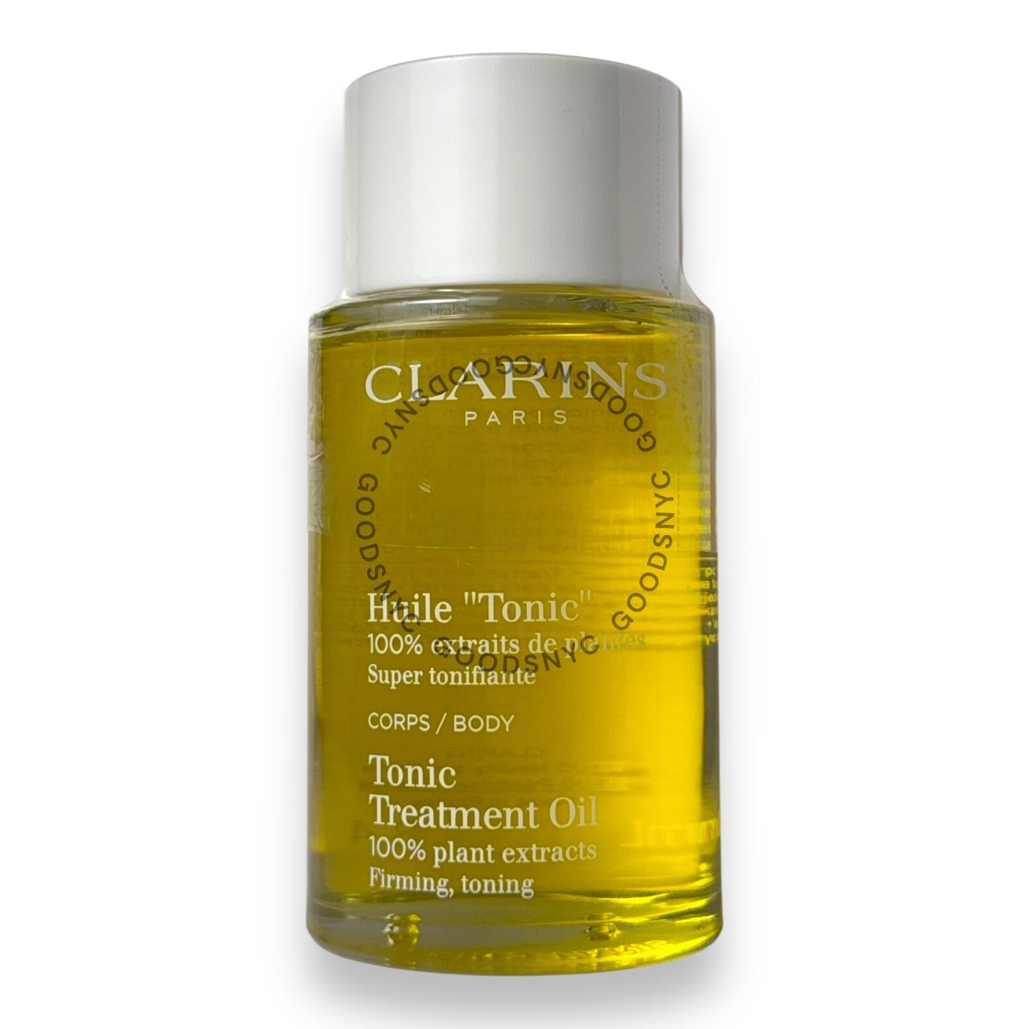 Bottle of Clarins Tonic Treatment Oil on a white background