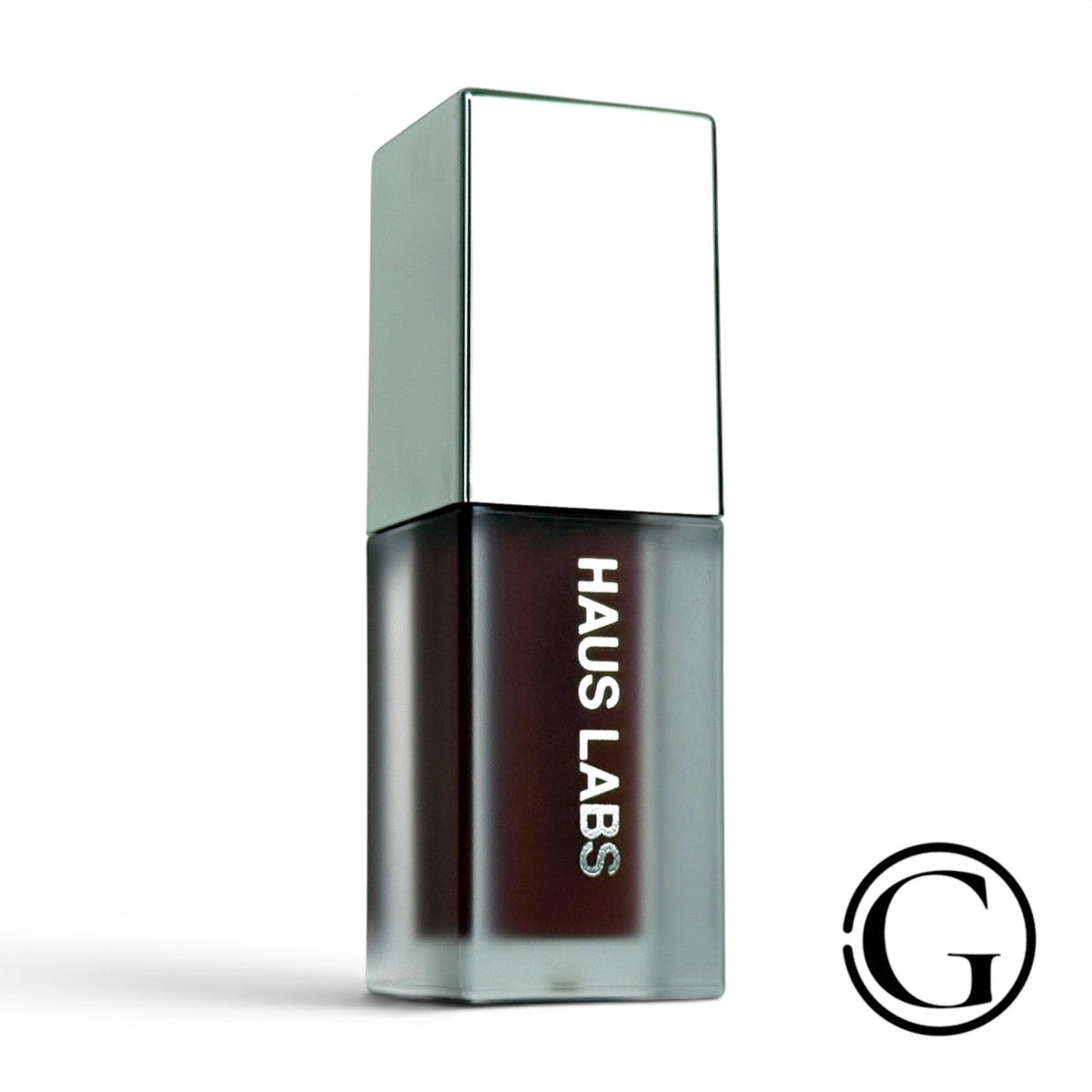 GOODSNYC Haus Labs PhD Hybrid Lip Glaze in Persimmon, a mini coral-orange plumping gloss with a glass-like finish.