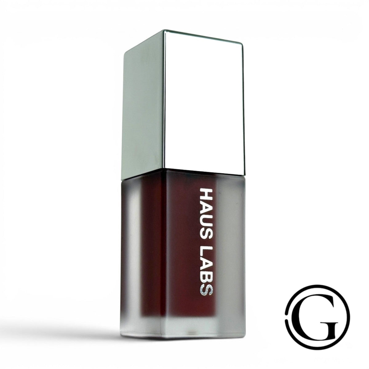GOODSNYC Haus Labs PhD Hybrid Lip Glaze in Persimmon, a mini coral-orange plumping lip gloss with a glass-like shine.
