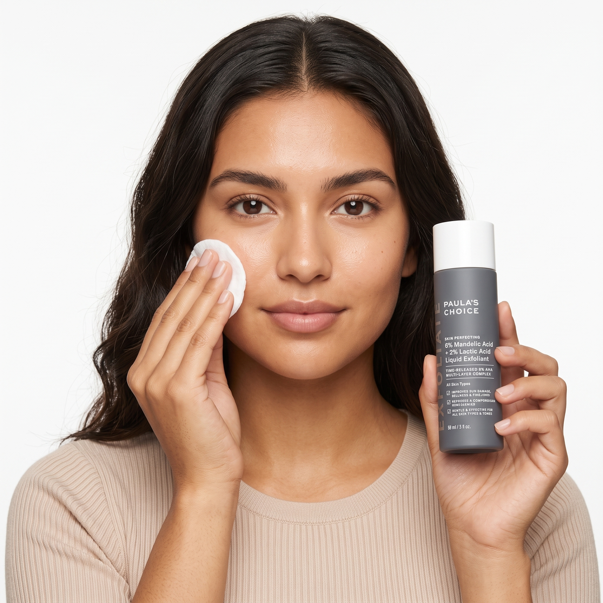 Who should try Paula's Choice Mandelic + Lactic Acid Liquid Exfoliant — model applying exfoliant with a cotton pad