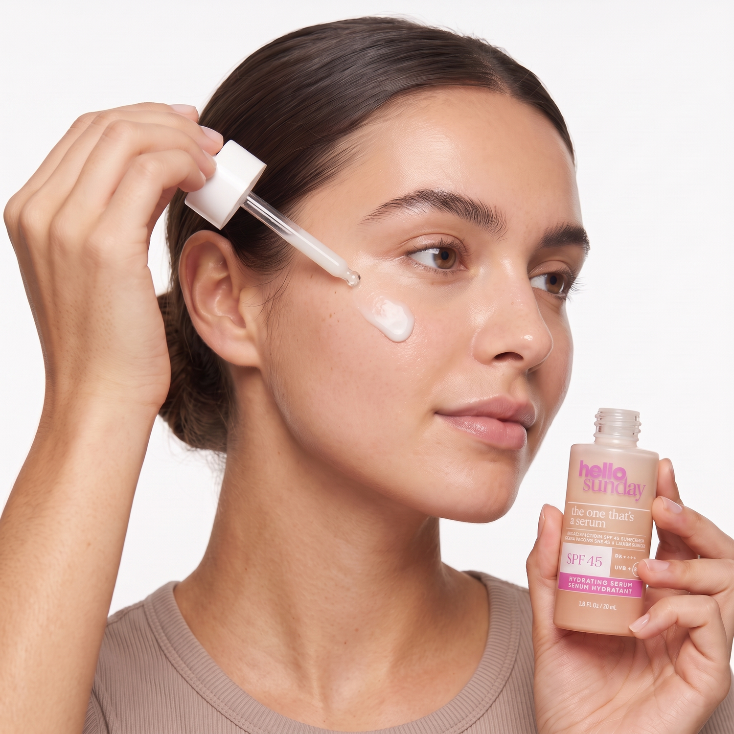 Who should try Hello Sunday The One That's a Serum SPF 45 — model applying the white serum sunscreen