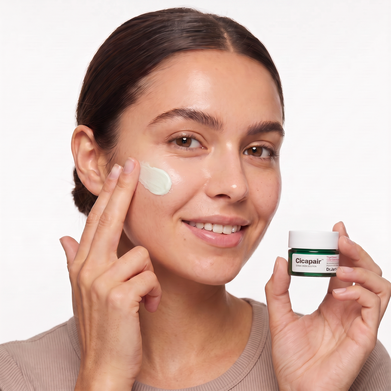 Who should try Dr. Jart+ Cicapair Tiger Grass Color Correcting Treatment — model applying the green color-correcting cream