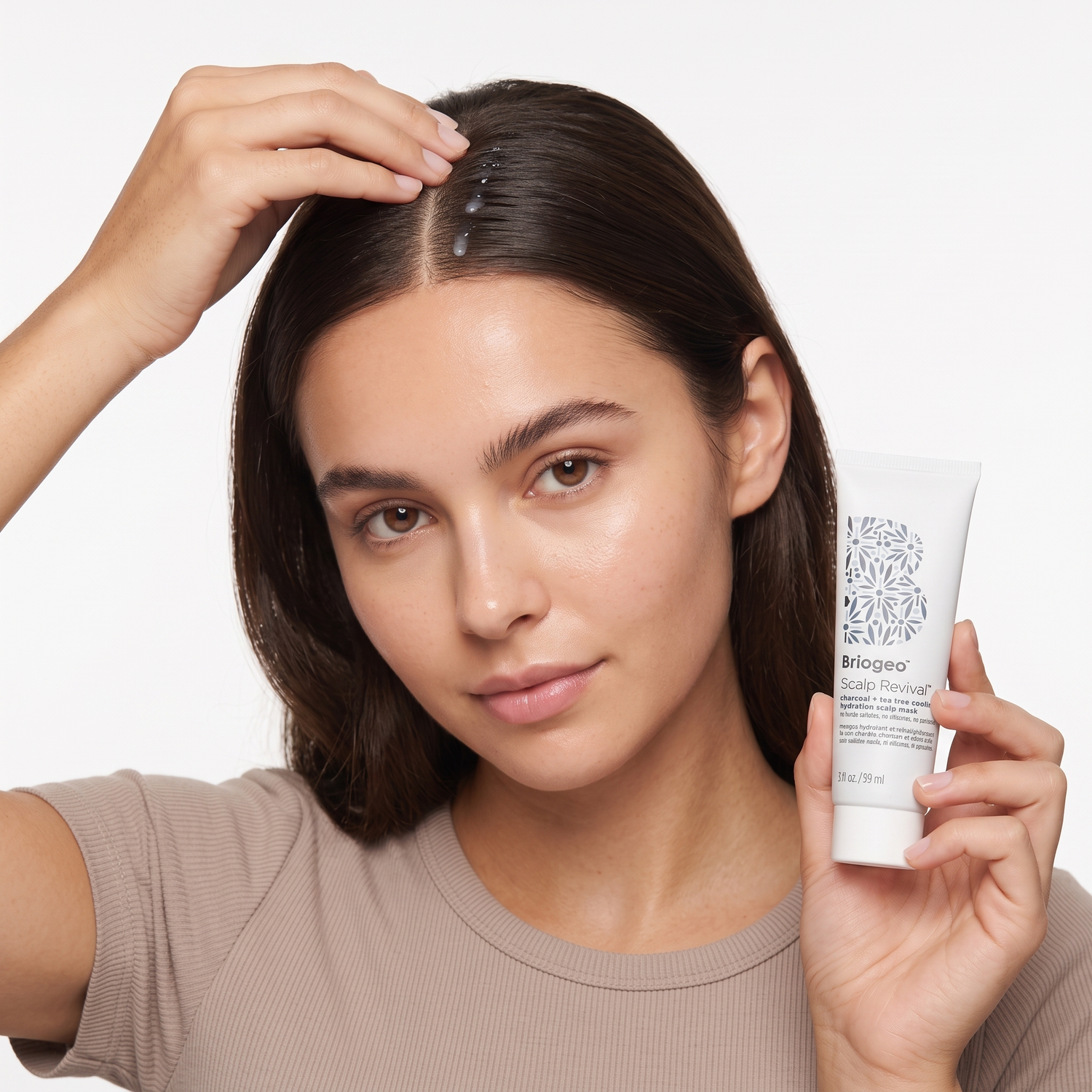 Who should try Briogeo Scalp Revival Charcoal Tea Tree Scalp Mask — model applying scalp treatment