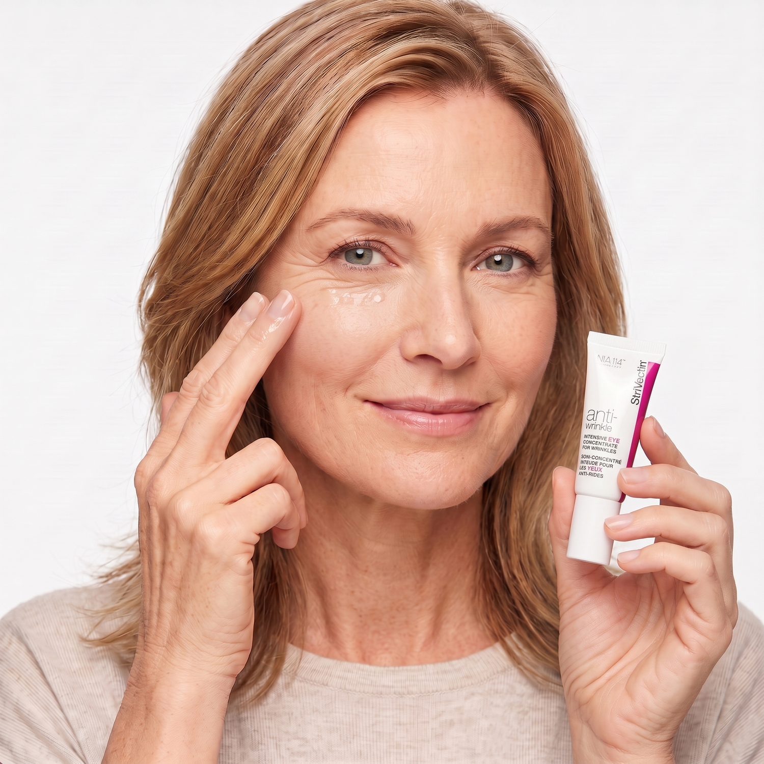 Who should try StriVectin Intensive Eye Concentrate — mature model patting eye cream under her eye
